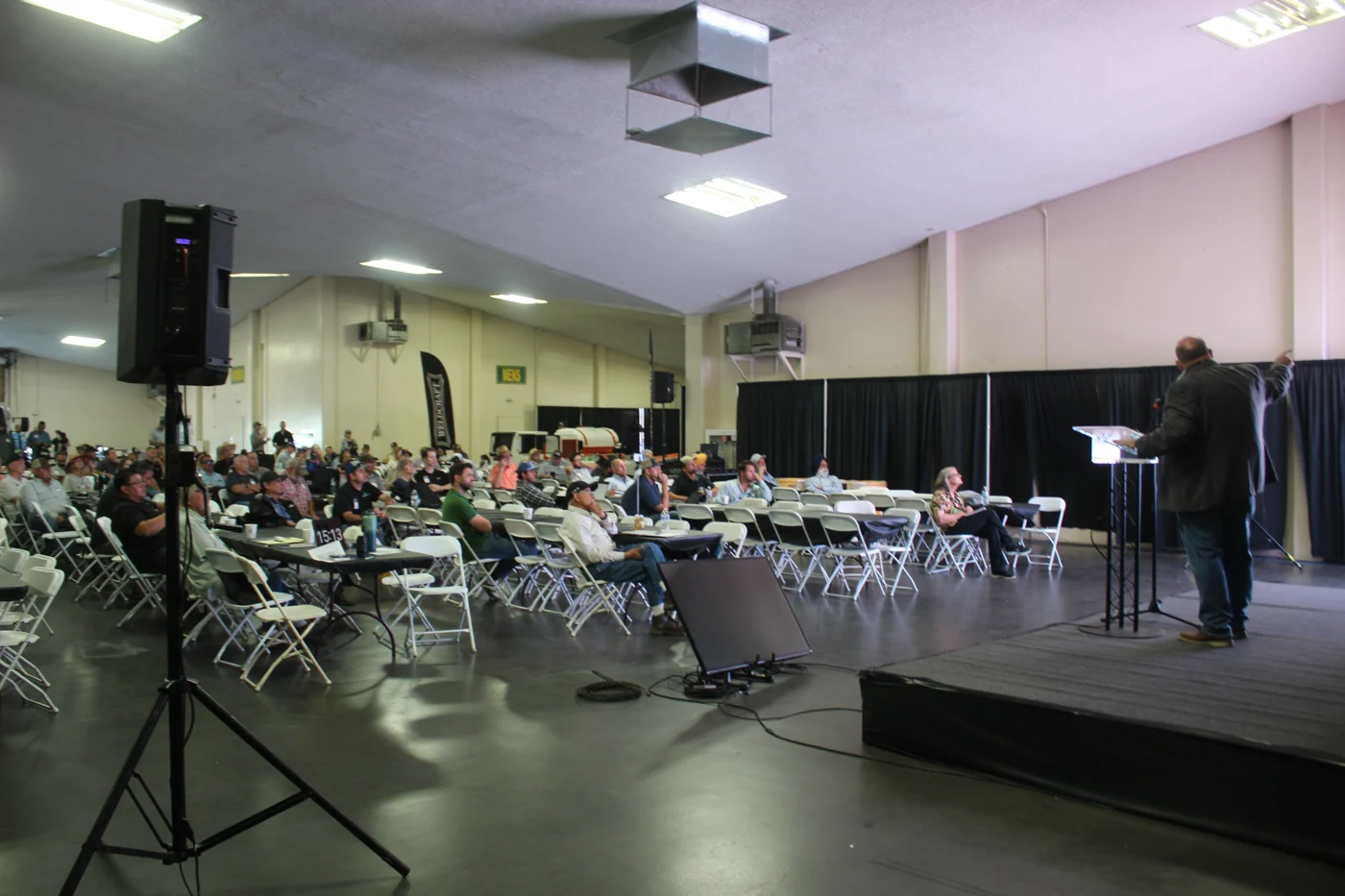 A full room listening to a speaker on stage at Almond Day 2026