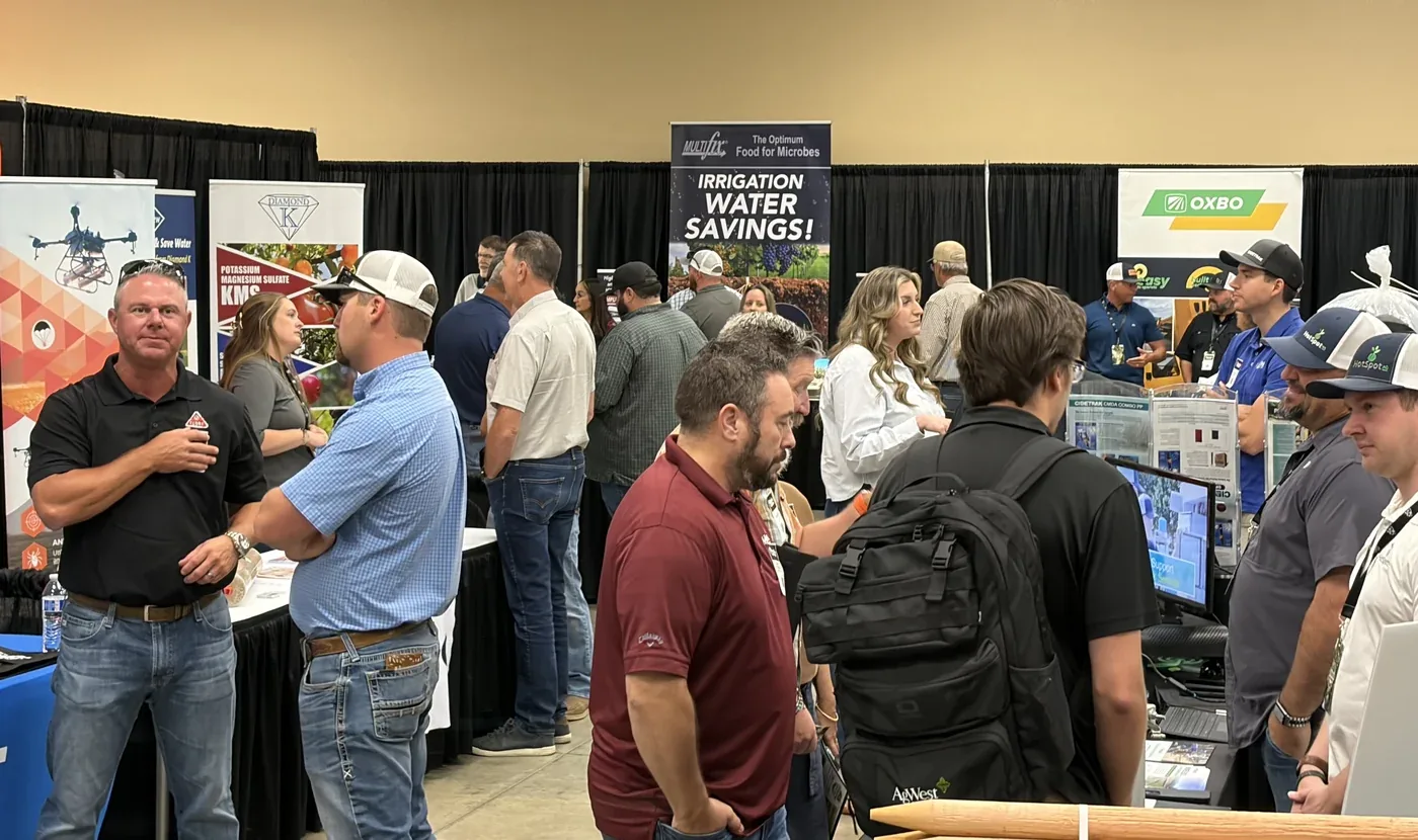 Attendees talking with exhibitors at Pistachio Day 2026
