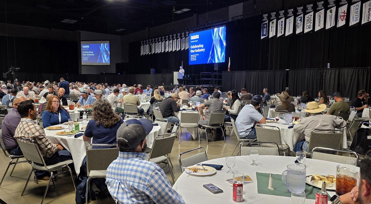 A full Expo Hall at the Day 2 awards luncheon, Celebrating Our Industry on the big screen