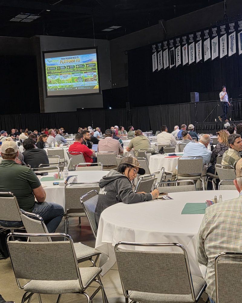The Expo Hall at 9:38 AM, tables filled for the Day 1 morning session