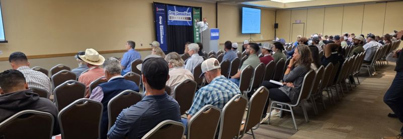 A wide view of a breakout room with every row of chairs filled