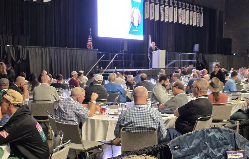 Attendees at crowded lunch tables in the Expo Hall on Day 1
