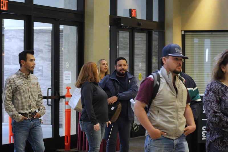 Attendees gathering inside the front doors of the Visalia Convention Center on Day 1