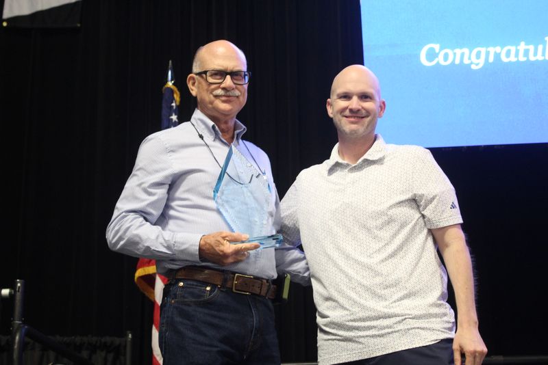 Gary Osteen holding his 2026 PCA of the Year award