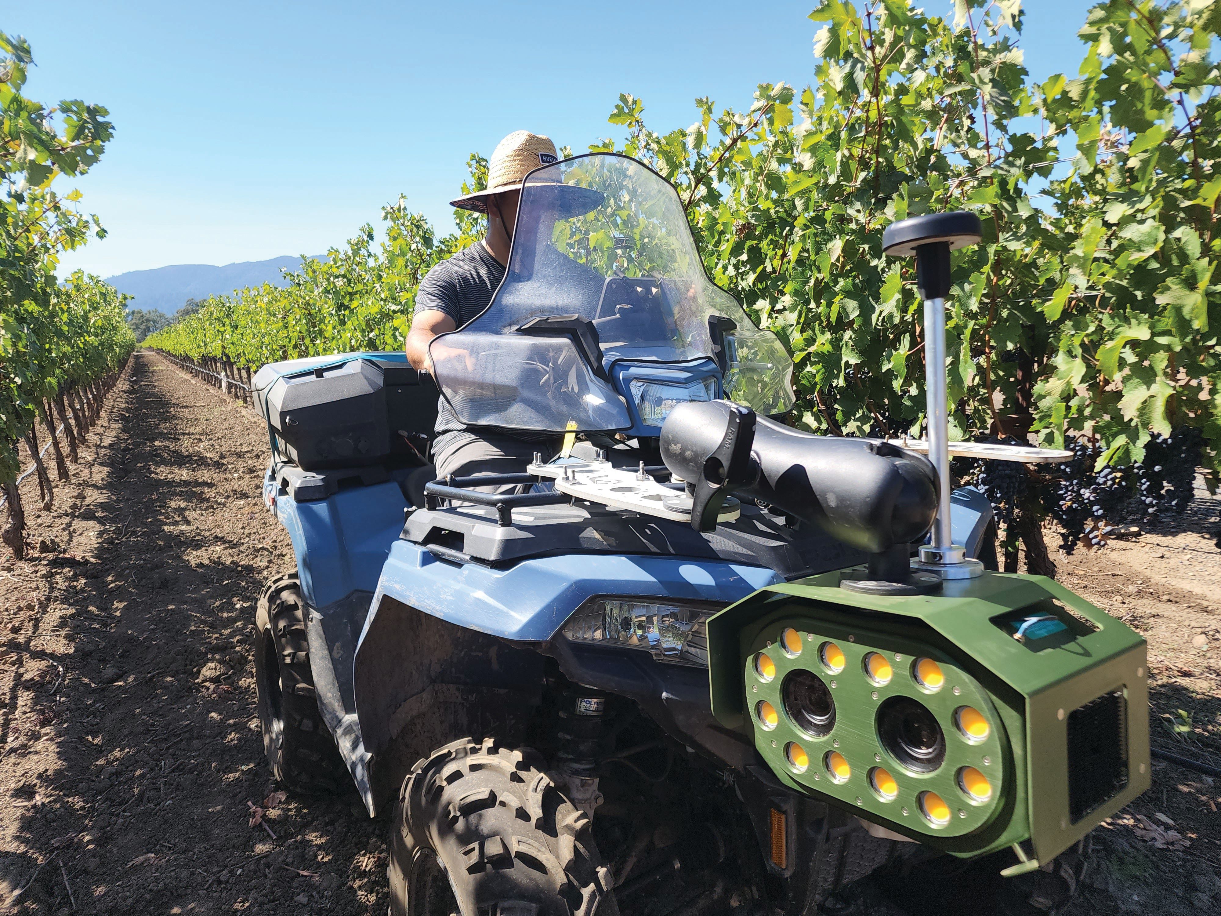 A Bloomfield Robotics camera system mounted on an ATV scans an orchard canopy in California