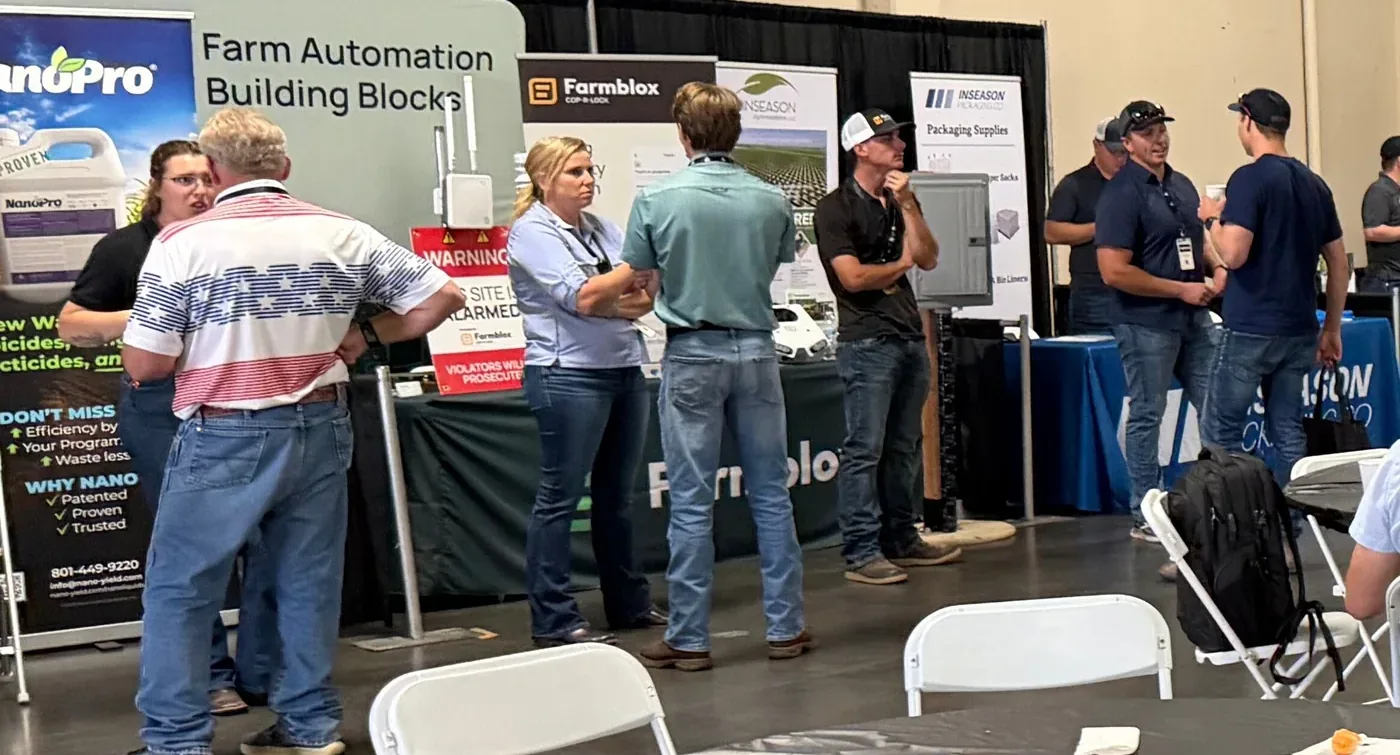 Attendees meeting with exhibitors at Almond Day 2026